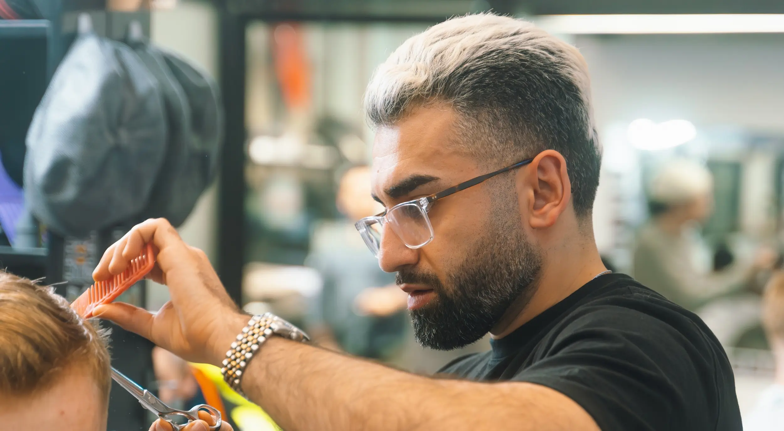 Kaywan, Christchurch Barber and co-owner of The Modern Man barbershop located at the Crossing Next to Barkers having a yarn with his regular client
